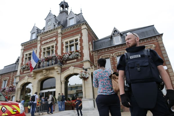 French priest killed by attackers 'claiming allegiance to IS'