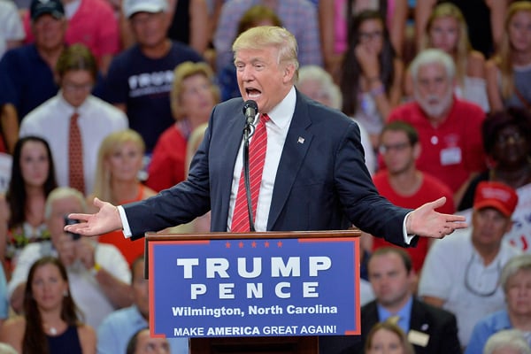 Trump criticized for offhand gun rights slap at Clinton