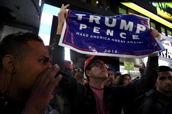 Trump wins Ohio, battles Clinton for lead in close battleground races