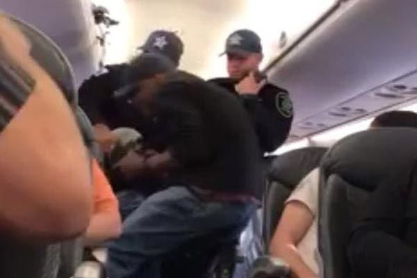 United Airlines: Passenger forcibly removed from flight
