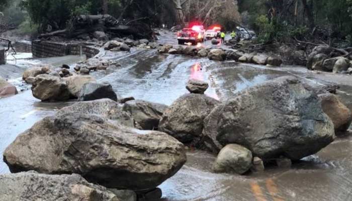 Waist-deep California mudslides kill 13