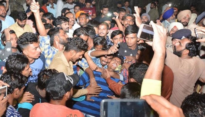 Search for blame after train mows down crowd