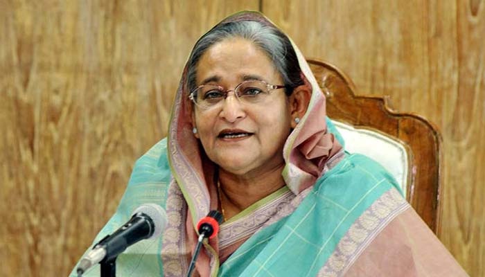 PM returns home from Spain