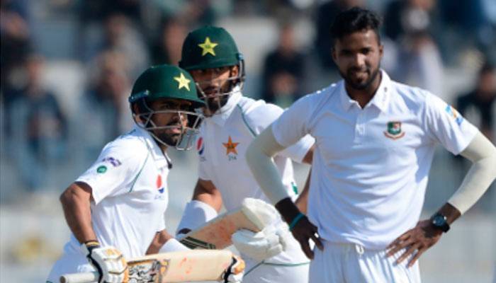 Babar, Masood punish Bangladesh