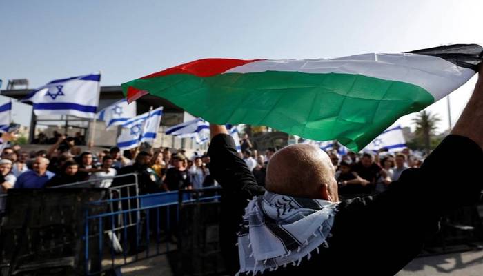 Flag-waving Israelis take to streets, skirmishes erupt in Al-Aqsa mosque