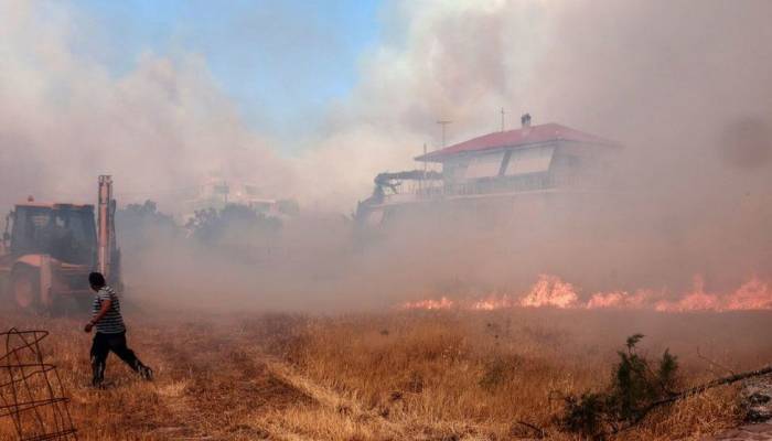 Wildfires burn coastal homes, forests in Greece as Europe's heatwave spreads east