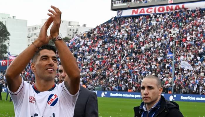 Thousands greet Suarez on return to Nacional