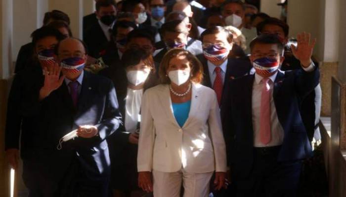 Pelosi at Taiwan parliament as China summons US ambassador