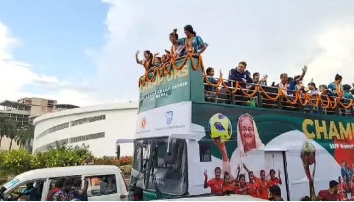 Victorious Bangladesh women's football team returns home