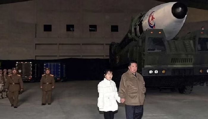 North Korea's Kim reveals daughter at ballistic missile test