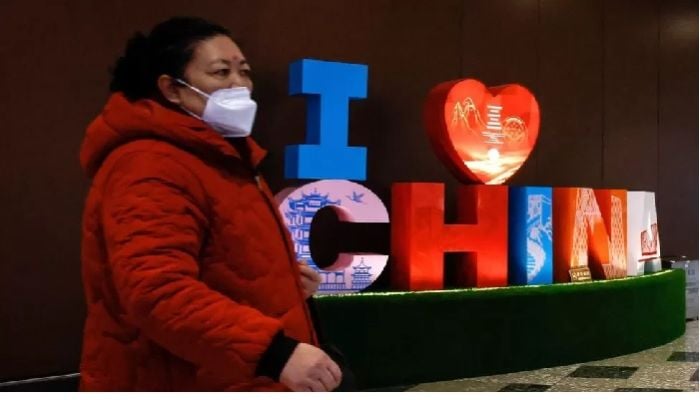 China ends Covid quarantine for travellers in January