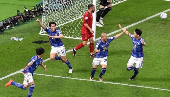 Japan stun Spain but both reach World Cup last 16