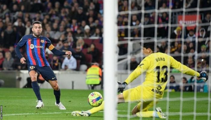Barcelona go eight points clear by beating Sevilla
