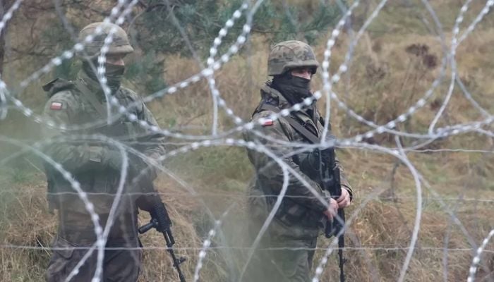 Why are tensions mounting on the Belarus-Poland border?