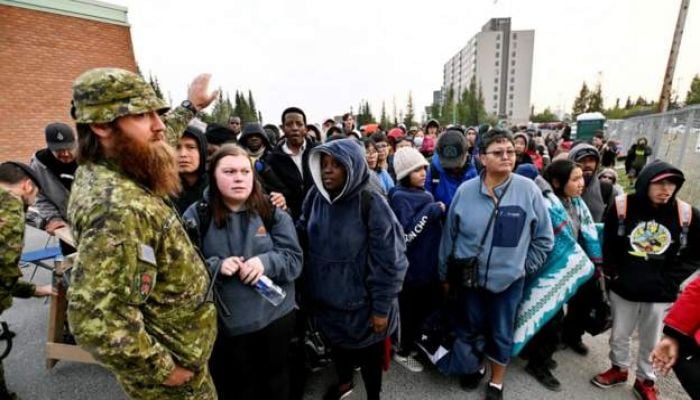 Race to evacuate northern city as wildfires rage across Canada