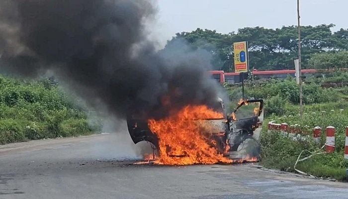 Microbus catches fire on Purbachal Expressway