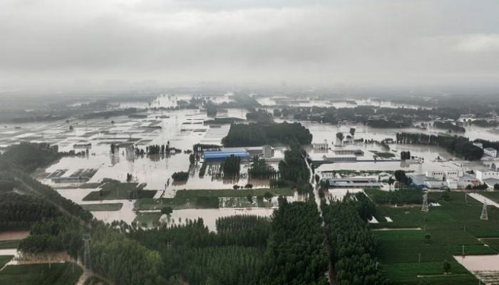 Streets become rivers as Beijing records heaviest rain 