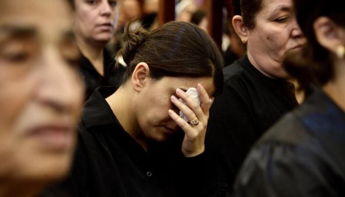 Grief, anger at Iraq mass for victims of wedding fire