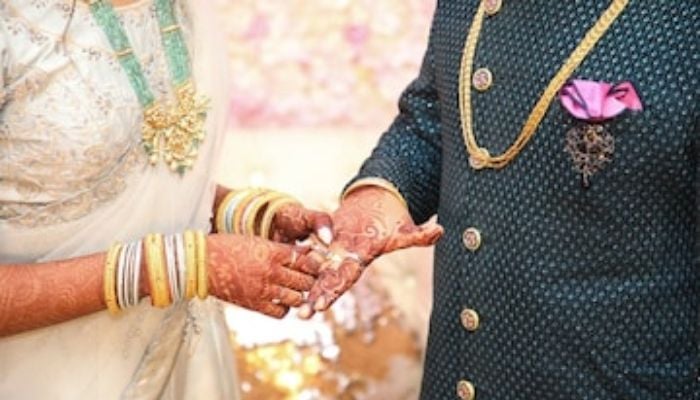 Bangladeshi couple's research-themed wedding card amazes internet