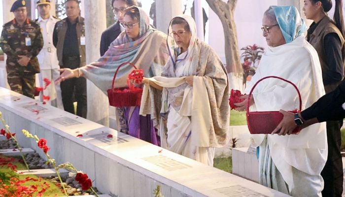 Sheikh Hasina pays respect to martyred family members
