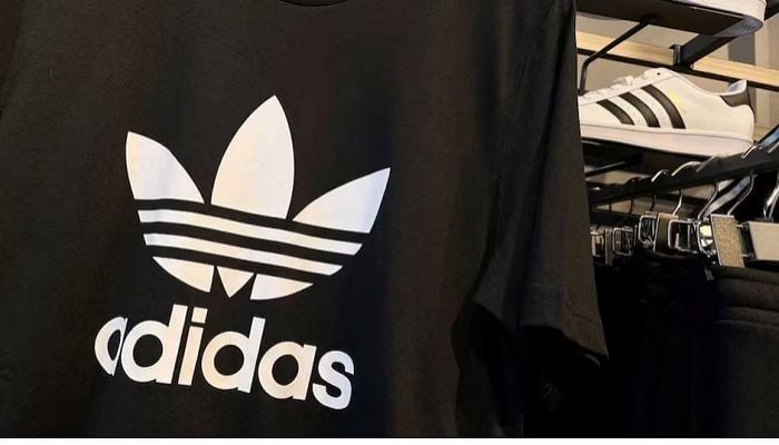 Adidas posts first loss in 30 years and warns on US