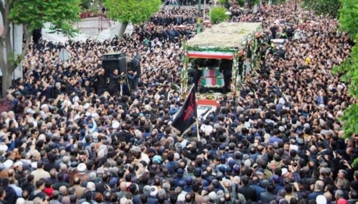 Tens of thousands gather for Raisi funeral procession in Tehran