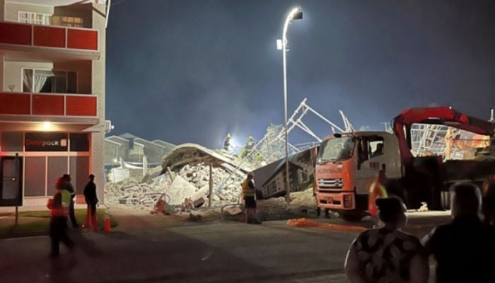 S. Africa building collapse kills four, traps dozens