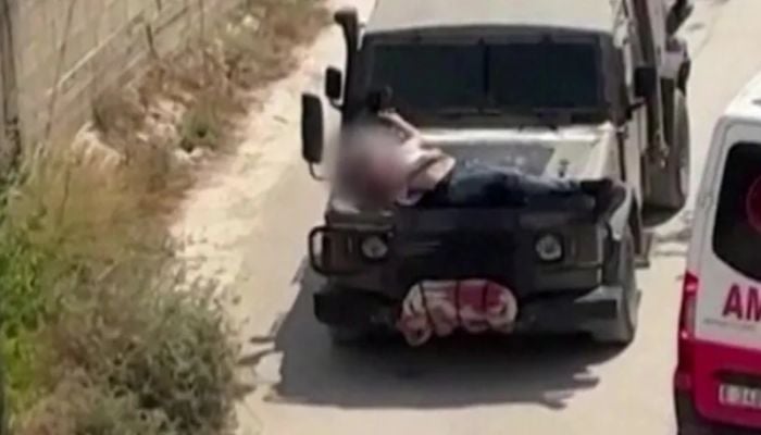 Israeli army strapped wounded Palestinian to jeep