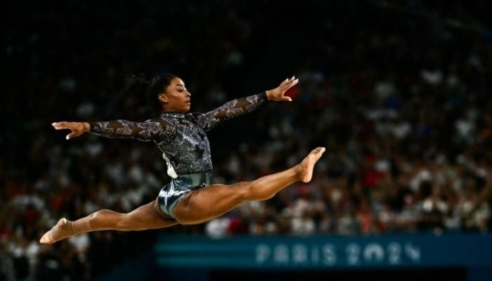 Biles dazzles in Paris Olympics debut despite injury scare
