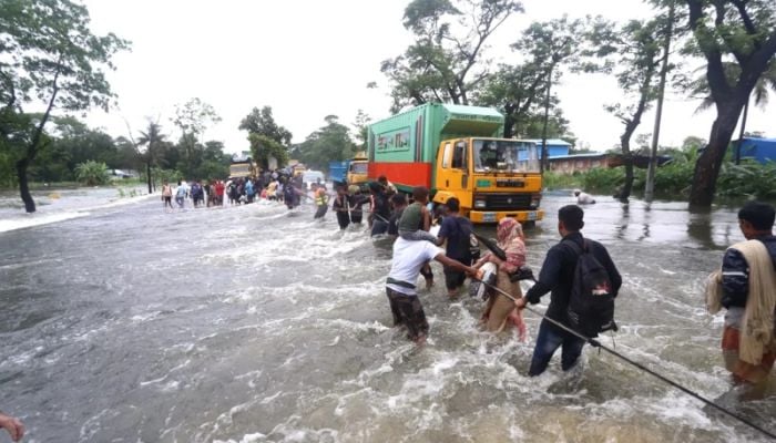 In pictures: Deadly floods leave millions stranded