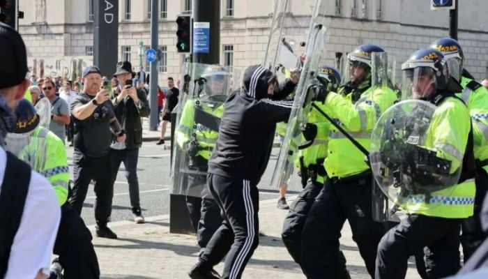 Far-right protesters clash with police in UK cities