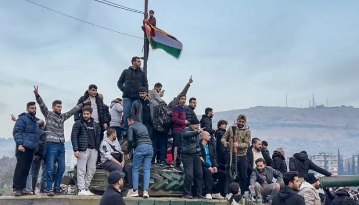 Celebrations in Damascus as Syrian opposition declares end of al-Assad rule