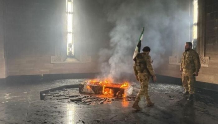 Syrian rebel fighters set fire to tomb of Bashar al-Assad's father