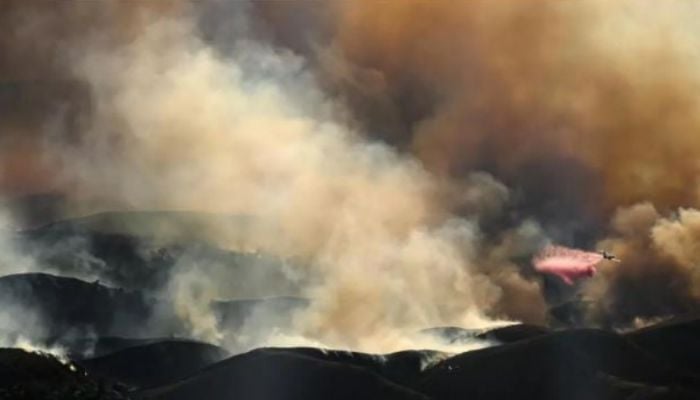 Air tankers fight Los Angeles fires from frantic skies