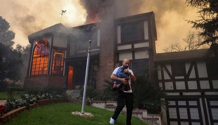 Los Angeles faces more wildfire evacuations even as fierce winds ease