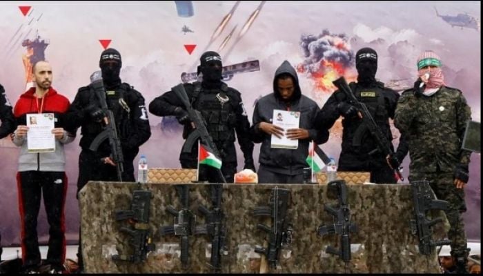 Hamas hands over first of six hostages with Israel set to free hundreds of Palestinian prisoners