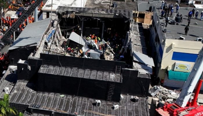 Death toll in Dominican nightclub roof collapse hits 226