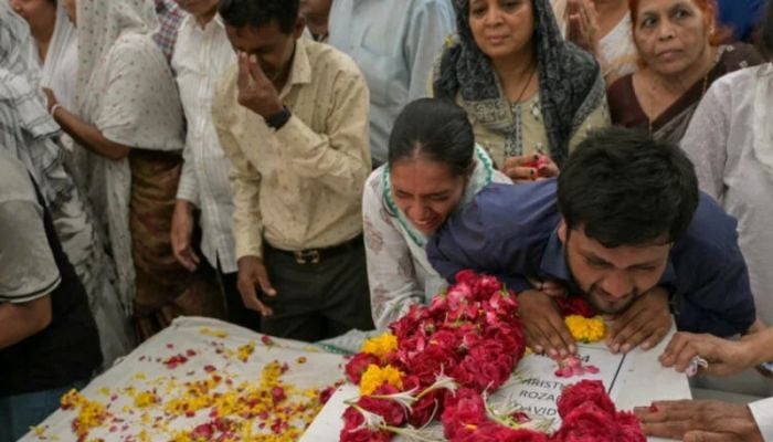 Relatives wait for remains after Air India crash