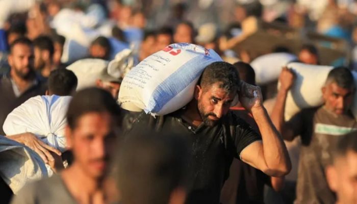 At least 30 killed by Israeli fire while waiting for aid
