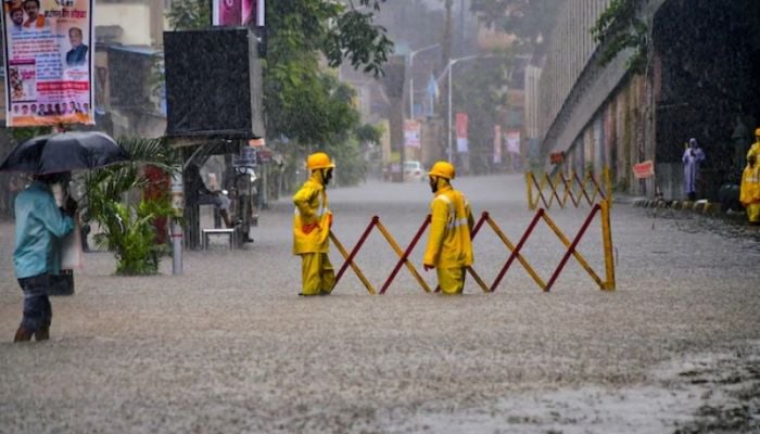Mumbai schools shut, local trains delayed as heavy rain floods roads