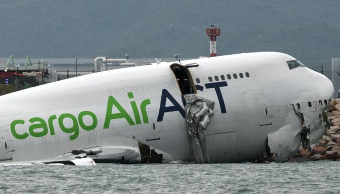 Cargo plane skids off Hong Kong airport runway into sea, leaving two dead