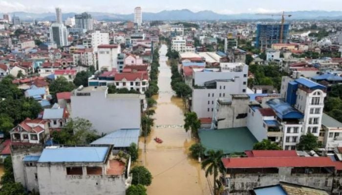 Record flooding hits Vietnam city, 8 killed in north