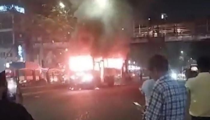 Bus set ablaze in front of LabAid Hospital in Dhanmondi