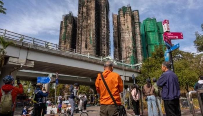 Hong Kong begins mourning period after fire kills at least 128