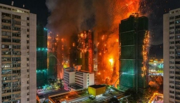 At least 13 dead as more than 700 firefighters tackle Hong Kong blaze