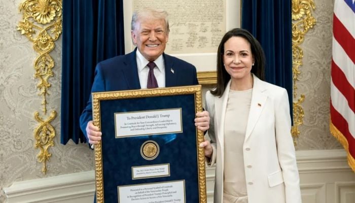 Venezuelan Nobel Peace Prize winner presents her medal to Trump