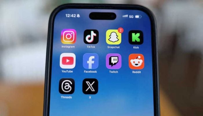 Heavy social media usage erodes young people's wellbeing, report finds