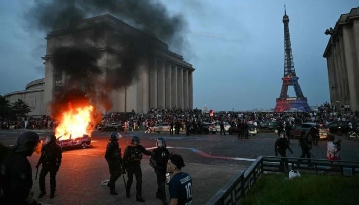 French police arrest 780 after violent clashes as PSG fans celebrate Champions League win