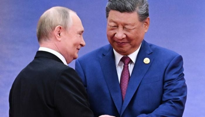 Vladimir Putin arrives in Beijing for state visit hot on heels of Trump
