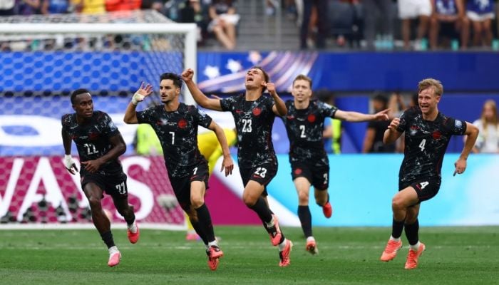 Canada reach last 16 after 92nd-minute winner against South Africa